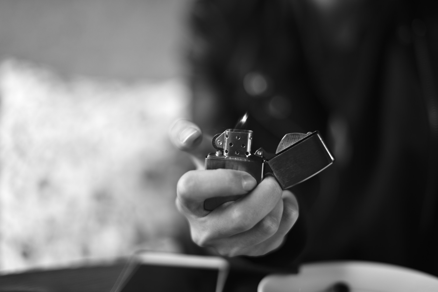 An Image of a Wholesale Lighter in Use, Lit by a Man 