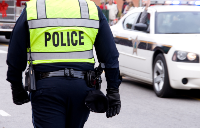 An image of a policeman from behind