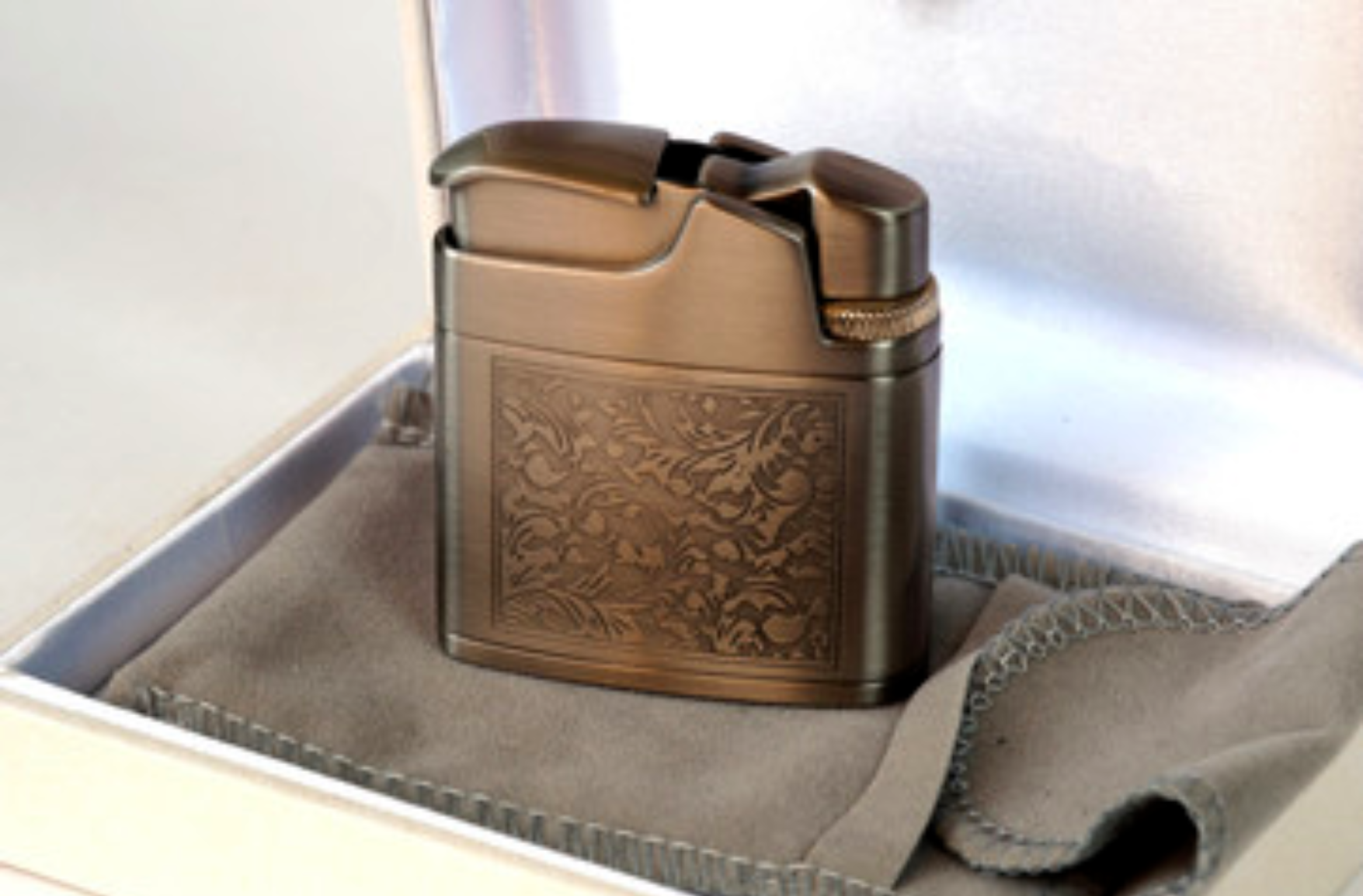 An Image of a Metal Lighter with Engravings
