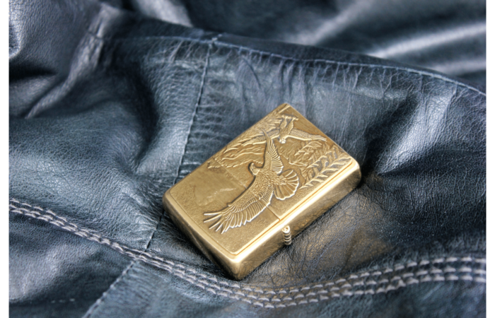 gold color designed aesthetic gold lighter on a denim